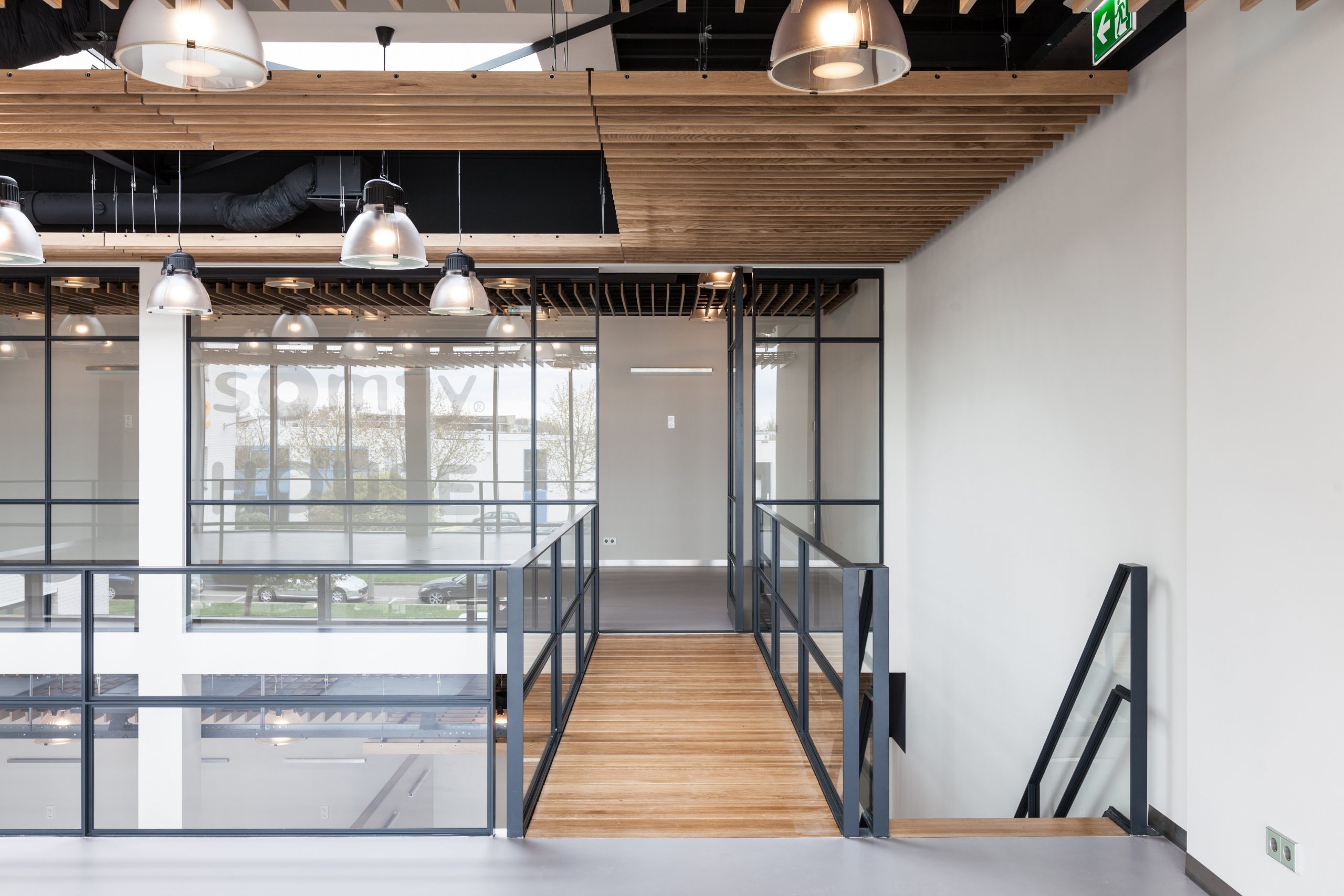 steel-framed-glassdoor-opened-pivot-door-fritsjurgens-scaled.jpg